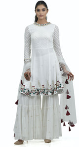 white peplum sharara suit by poshak