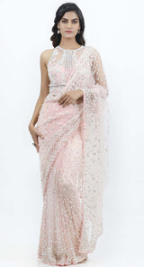 A very stylish saree in pure net fabric with intricate pearl embroidery and teamed up with a very stylish blouse with all hand embroidered peal and bead work.